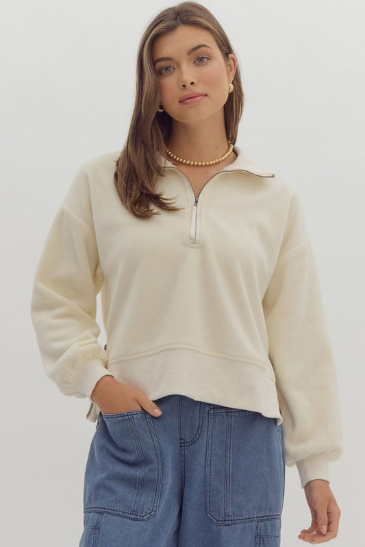 +Solid long sleeve collared crop sweater featuring quarter zip detail.