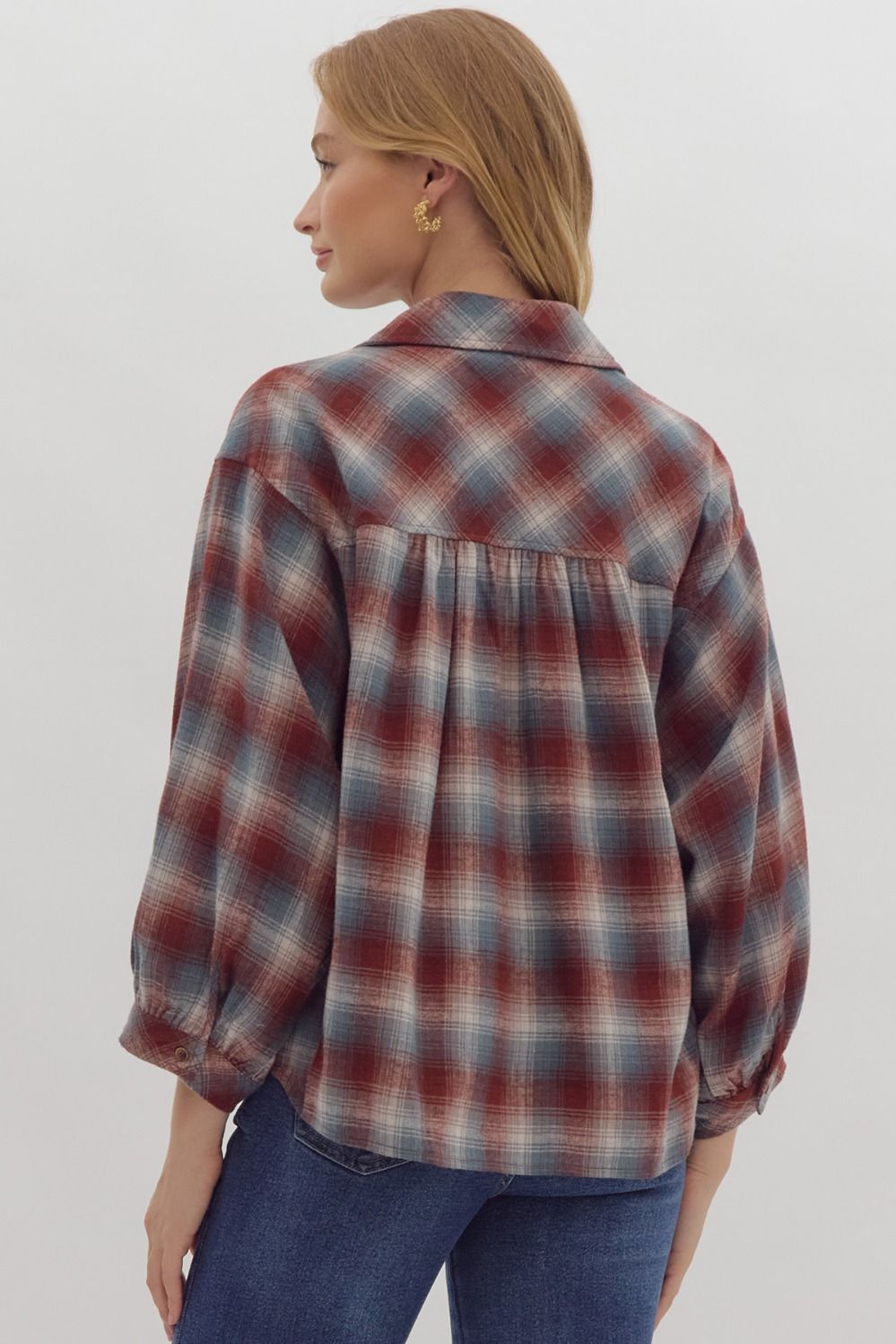 Plaid print 3/4 sleeve button down top featuring pocket detail at bust.