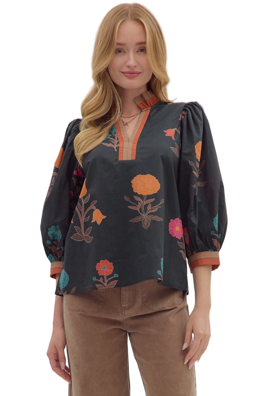 Floral print 3/4 puff sleeve top featuring contrast trim split neck and cuffs